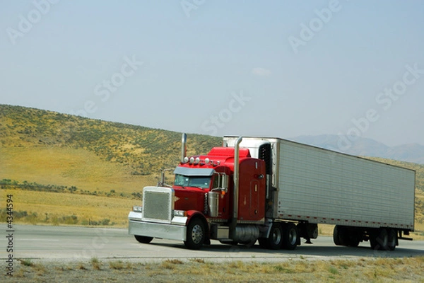 Fototapeta Semi truck going fast on interstate highway