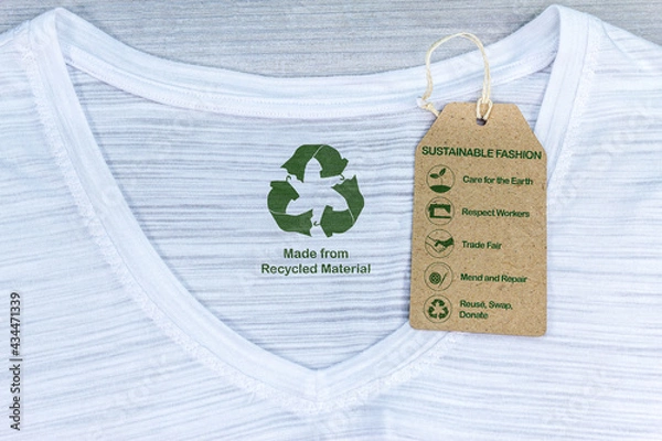 Obraz Made with recycled materials T shirt with sustainable fashion care label, care for the earth, respect workers, trade fair, wash cold, line dry, mend and repair, reuse, swap or donate with icons.