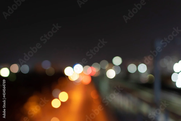 Fototapeta Abstract bokeh nightlight and blur car light bokeh on street background.
