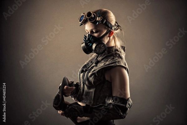 Obraz brutal woman in uniform and steampunk mask with axe