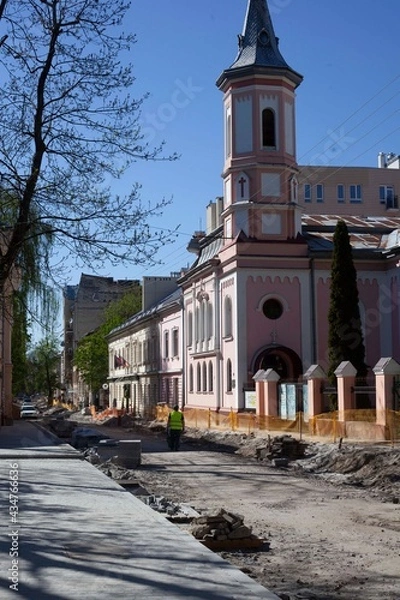 Obraz Road repairs, installation of a new sidewalk made of ancient cobblestones