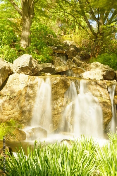 Obraz Water rushes down a waterfall.