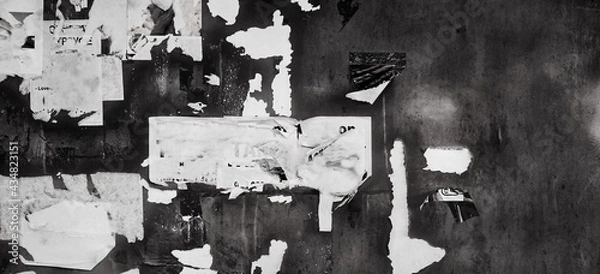 Fototapeta Grunge Wide Background with Old Torn Posters. Urban Graffiti Wall Texture. Grungy Ripped Wall with Torn Posters and Ads Background. Panoramic Urban Wallpaper. Graffiti Wall Texture.