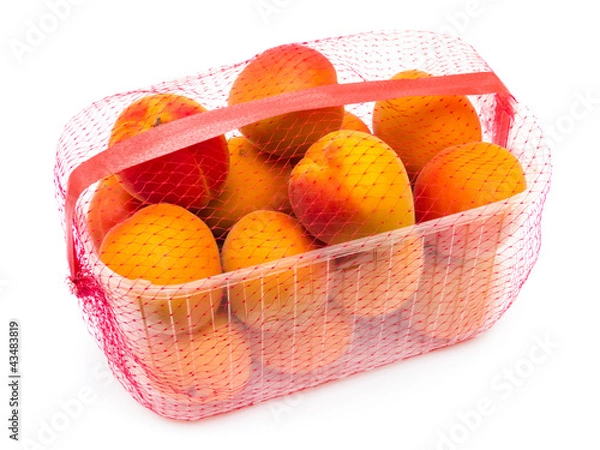 Fototapeta Apricots in Plastic Container Isolated on White
