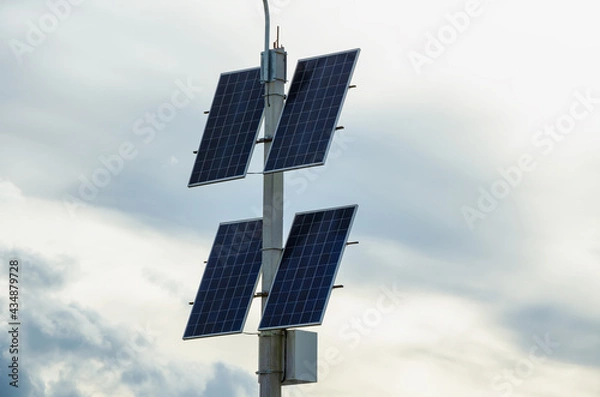 Obraz Solar panels on the background of clouds