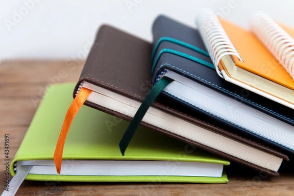 Obraz notebook stack on wood background
