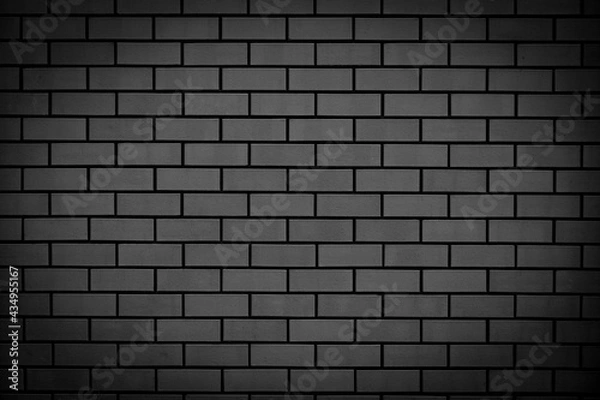 Fototapeta Black brick wall. Abstract background for design. Backdrop for product display.