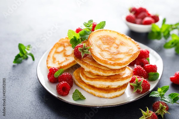 Fototapeta Breakfast pancakes with fresh raspberry