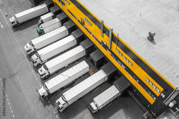 Fototapeta Aerial view of trucks loading in the distribution hub