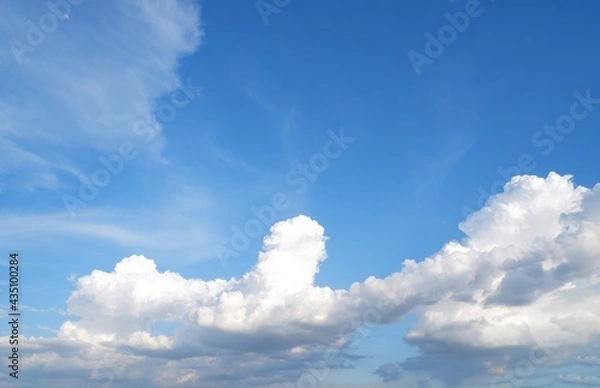 Fototapeta Blue sky background with white clouds on natural daylight