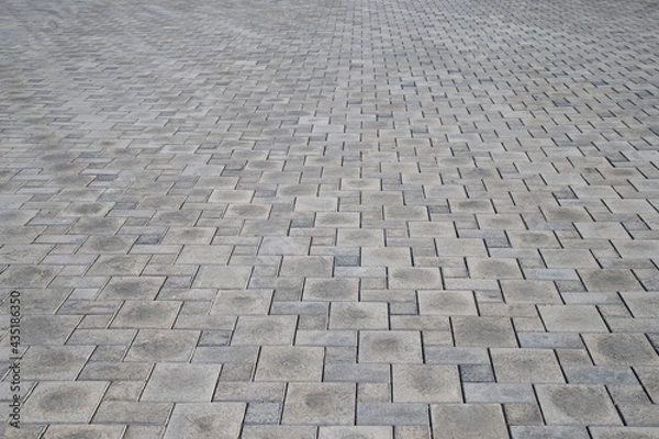 Fototapeta gray paving slabs on the city square