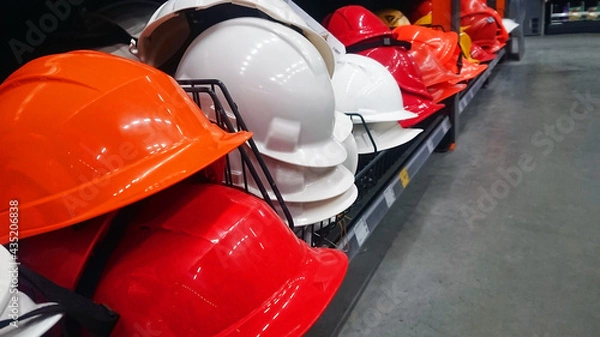 Obraz There are many colored construction helmets on the store shelves