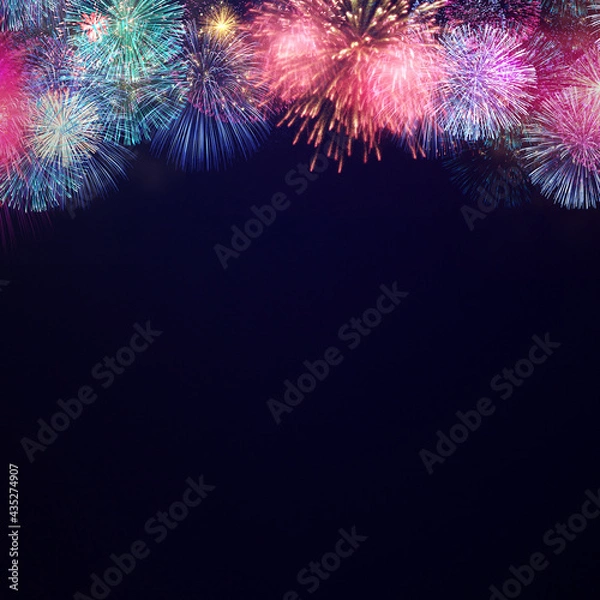 Fototapeta Fireworks explode at the top side. The copy space at below on dark background 2