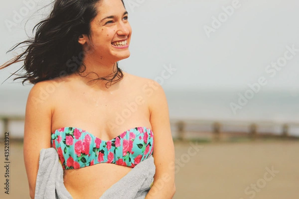 Obraz Glorious Seaside Smile: A Young Woman Enjoys the Beauty of the UK Coastline enjoying life 01