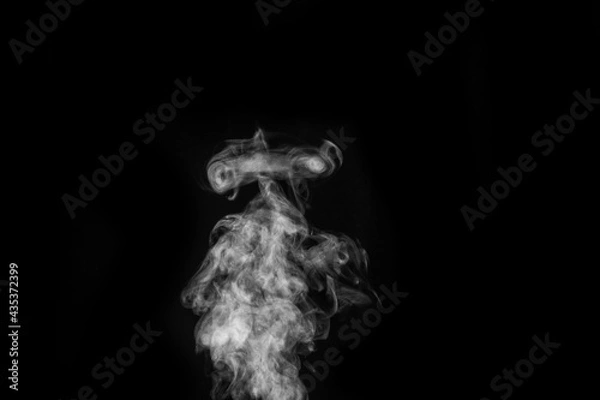 Fototapeta Perfect mystical curly white steam or smoke isolated on black background. Abstract background fog or smog