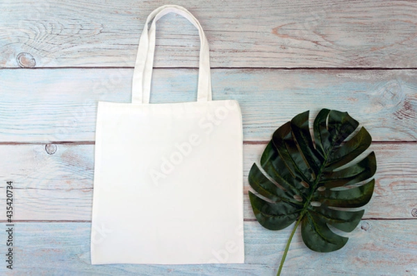 Obraz Tote bag canvas fabric cloth shopping sack mockup blank template on wooden background. Stock photo