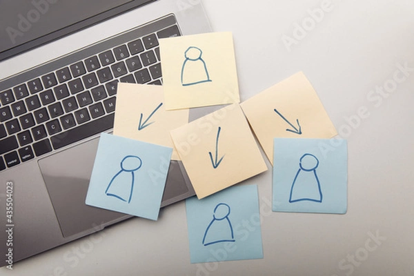 Obraz Delegation concept. Silhouettes drawn on sheets and arrows