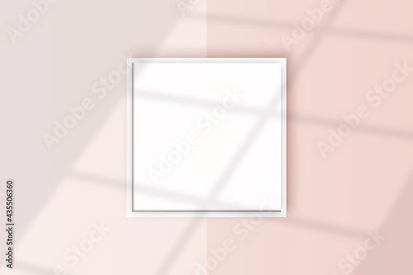Obraz Image of a square white frame mockup on a light pink wall blank mockup template.