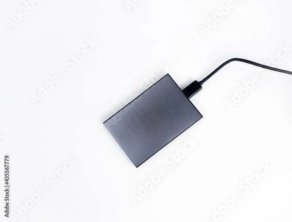 Obraz Gray external hard drive for data storage isolated on white background