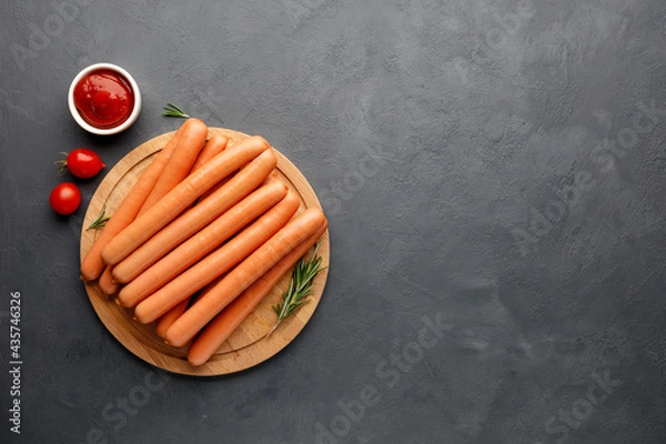 Fototapeta Vienna sausages. Top view with copy space for text. Black (dark) background.