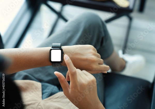 Obraz woman using smartwatch blank screen on top view