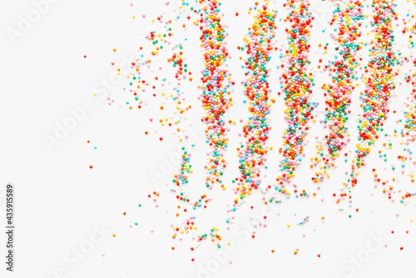 Fototapeta sprinkling, sprinkling for Easter cake, colored background 
