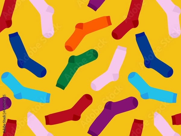 Fototapeta Multi-colored socks on a yellow background