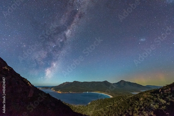 Obraz Milky Way and Aurora Australis over moonlit Wineglass Bay, Tasmania