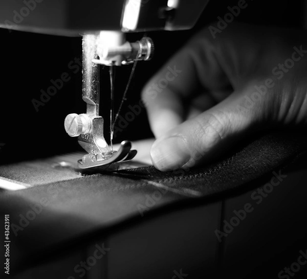 Fototapeta Seamstress Using Sewing Machine
