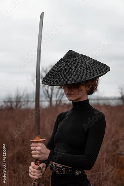 Obraz samorui girl in the field with a katana