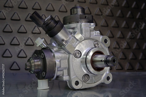 Fototapeta Close-up of a new original high-quality fuel injection pump. Selected focus.