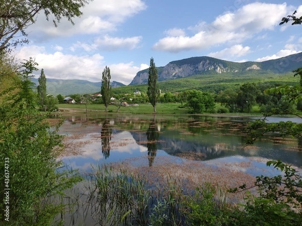 Fototapeta Crimean peninsula. Summer landscape in the mountainous Crimea with a lake, trees and clouds.