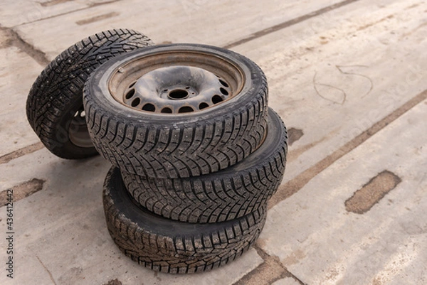 Obraz Moscow. Russia. Summer 2020. Winter wheels from the car. Old studded wheels on rusty wheels.