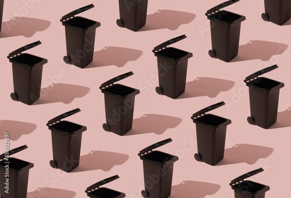 Fototapeta Abstract pattern with a container on a pink background. The concept of waste sorting and ecology. Can be used as a background.