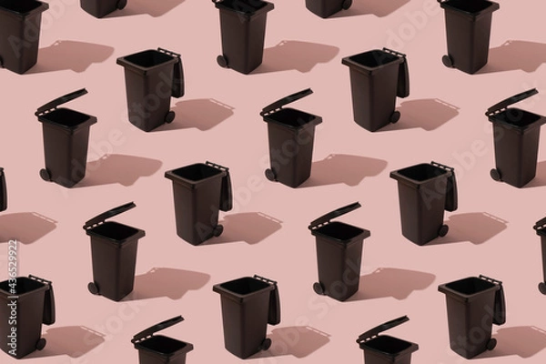 Fototapeta Abstract pattern with a container on a pink background. The concept of waste sorting and ecology. Can be used as a background.