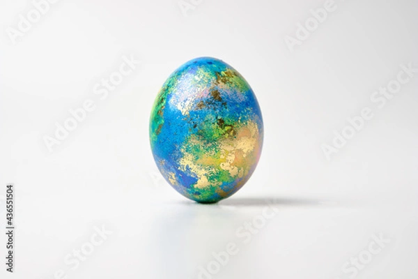 Fototapeta Easter eggs. Easter background. Easter. Copy cpase egg isolated on a white background painted like planet earth, a workpiece for the designer.