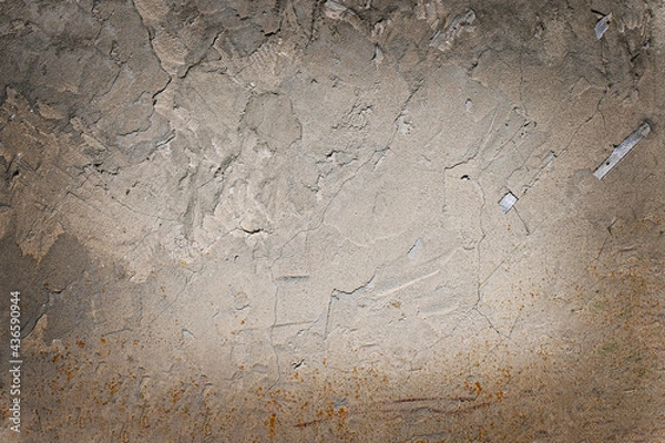Fototapeta .Plastered wall of an old house with traces of weathering. Uneven gray surface. Grunge. Texture. Background. Copy space.