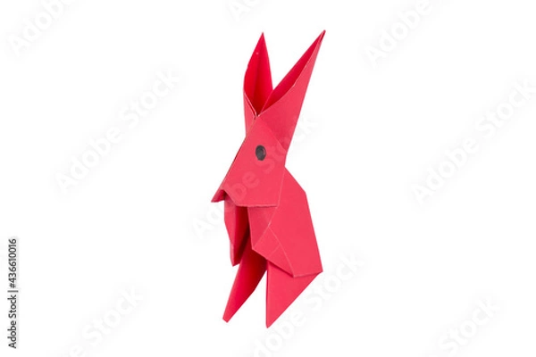 Fototapeta Pink little rabbit made with small craft paper and nicely placed on a paper background