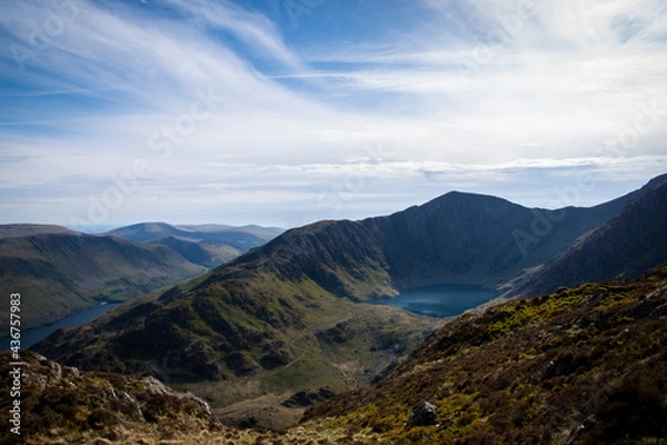 Fototapeta a view looing down in the crater of Cadair Idris with a mountain view behind it	