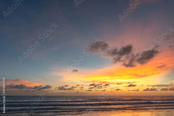 Fototapeta Majestic sunset or sunrise landscape Amazing light of nature cloudscape sky and Clouds moving away rolling .Beautiful Phuket beach is a famous tourist destination in Andaman sea summer. 