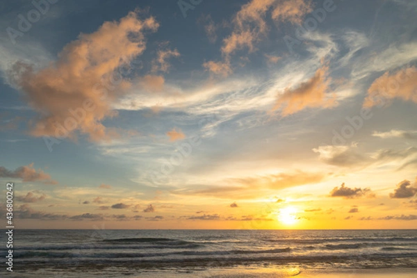 Fototapeta Majestic sunset or sunrise landscape Amazing light of nature cloudscape sky and Clouds moving away rolling .Beautiful Phuket beach is a famous tourist destination in Andaman sea summer. 
