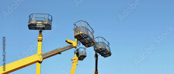 Obraz Four mobile platforms elevated towards a blue sky