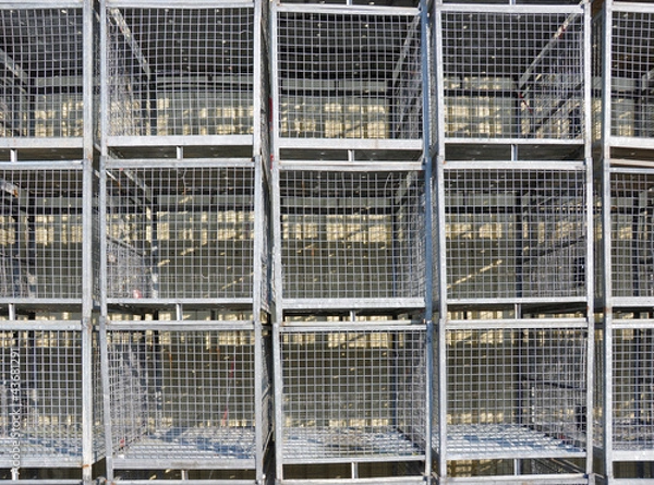 Fototapeta Stacked empty stock cages