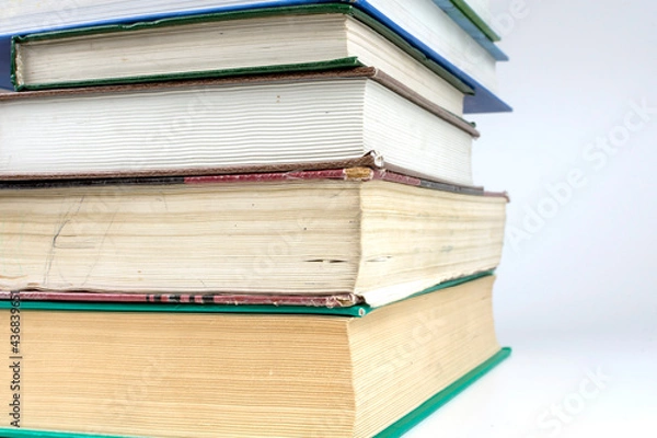 Fototapeta stack of thick books on white background