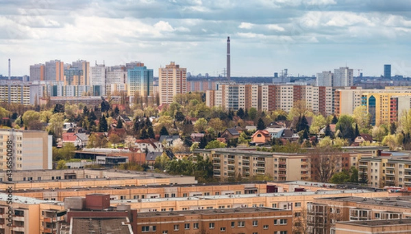 Obraz idyllic housing estate with windmill surrounded by high-rise buildings in berlin marzahn hellersdorf