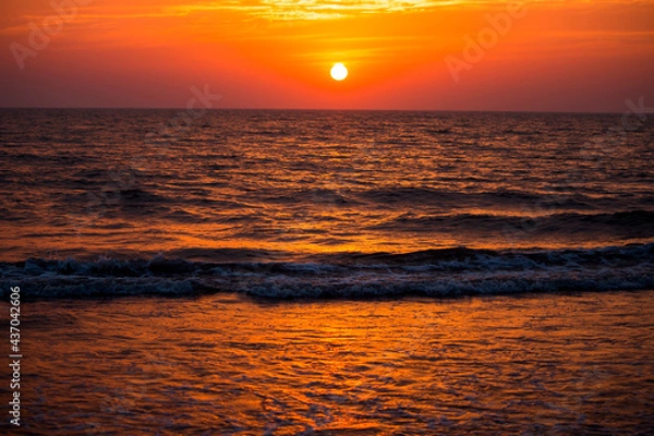 Fototapeta City's beach during sunset and dusk showing some magnificent colours