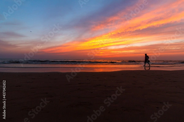 Fototapeta City's beach during sunset and dusk showing some magnificent colours