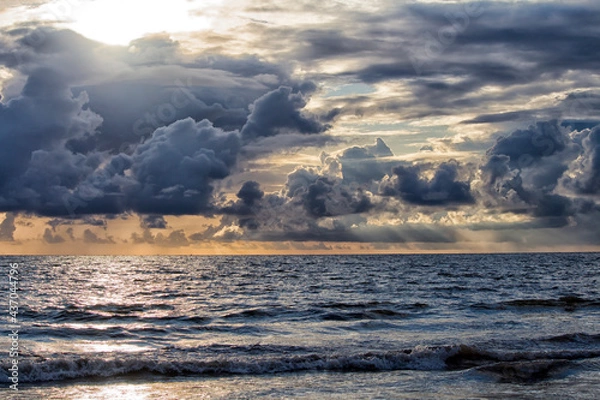 Fototapeta Clouds over a beach during pre-monsoon