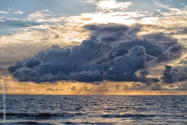 Fototapeta Clouds over a beach during pre-monsoon