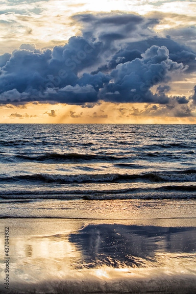 Fototapeta Pre-monsoon clouds during evening over a beach